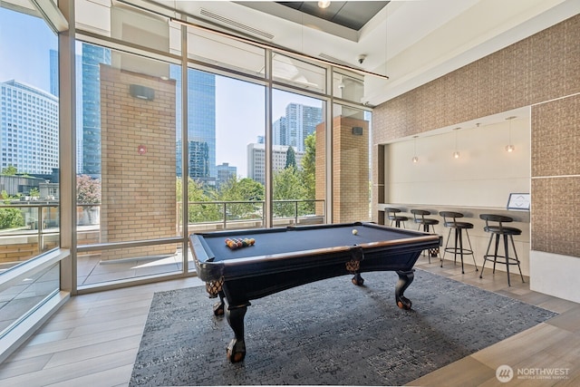 10610 NE 9th Pl Unit C4210, Bellevue, WA 98004 - recreation room with a view of skyline, wood finished floors, plenty of natural light, and a wall of windows