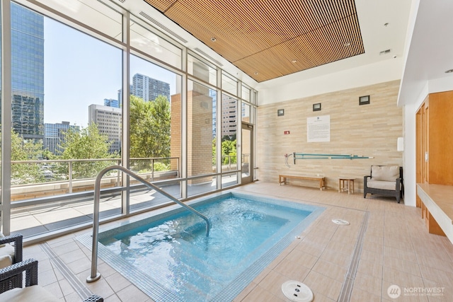 10610 NE 9th Pl Unit C4210, Bellevue, WA 98004 - view of swimming pool featuring a pool, a city view, and a hot tub