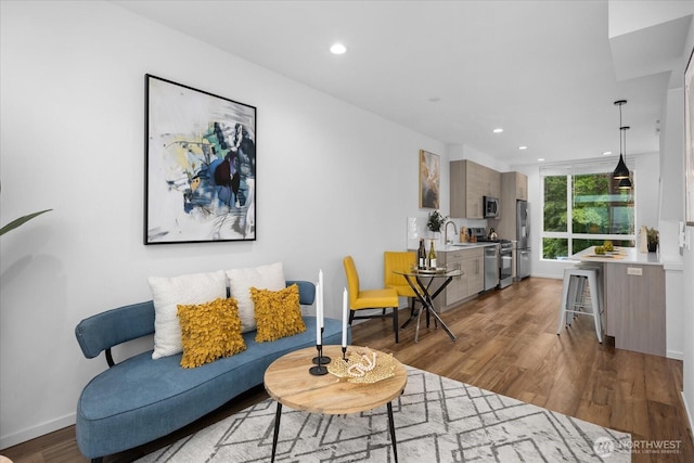 9030 18th Ave SW Unit E, Seattle, WA 98106 - living area with wood finished floors and recessed lighting