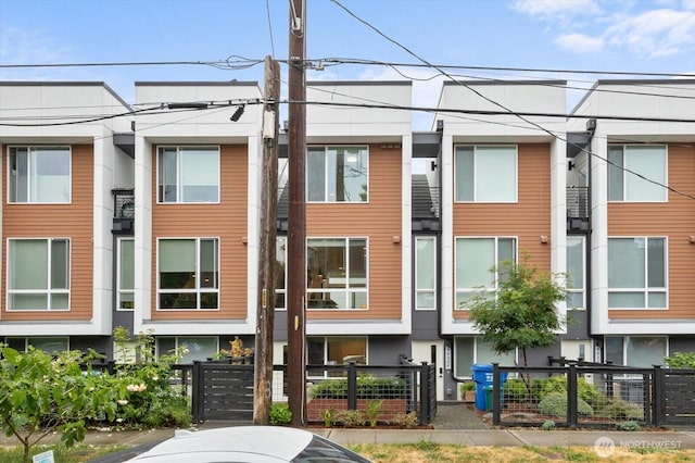 9030 18th Ave SW Unit E, Seattle, WA 98106 - view of front of property with a fenced front yard and a gate