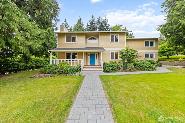 2515 16th St, Anacortes, WA 98221 - traditional home with a chimney, covered porch, and a front yard