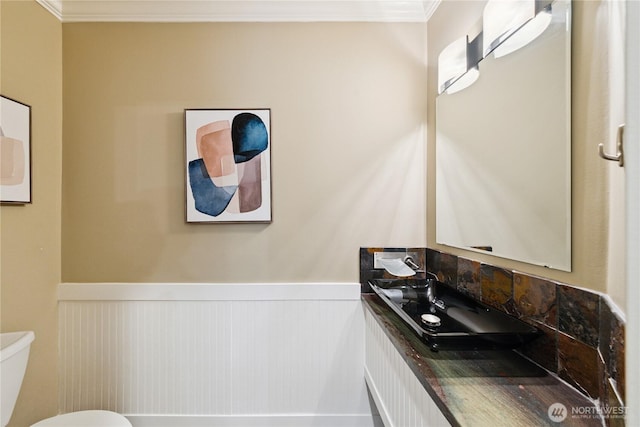 2515 16th St, Anacortes, WA 98221 - bathroom with a wainscoted wall, ornamental molding, and vanity