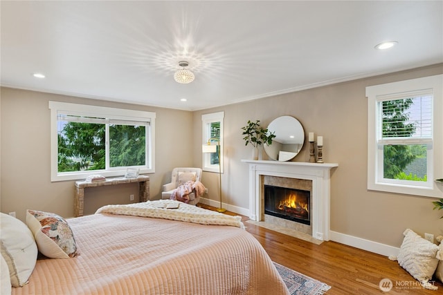 2515 16th St, Anacortes, WA 98221 - bedroom featuring wood finished floors, a fireplace, crown molding, and recessed lighting