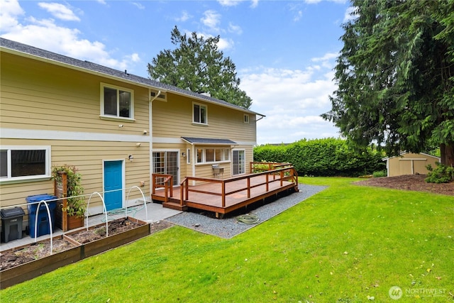 2515 16th St, Anacortes, WA 98221 - back of property featuring a storage unit, a wooden deck, a lawn, and a vegetable garden