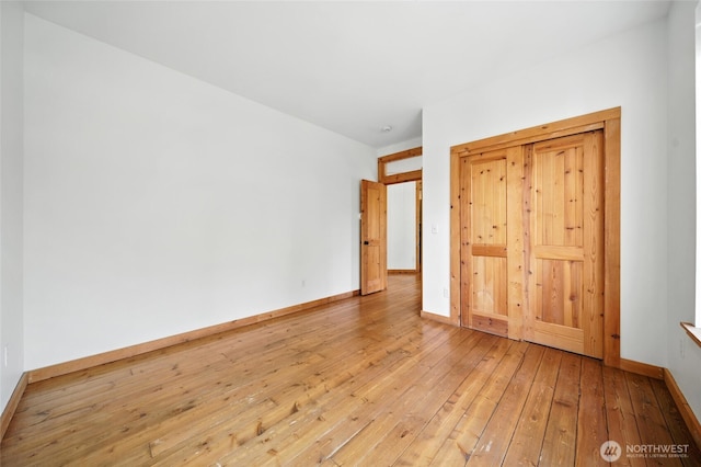 847 SE Covey Ct, College Place, WA 99324 - unfurnished bedroom featuring hardwood / wood-style flooring and baseboards