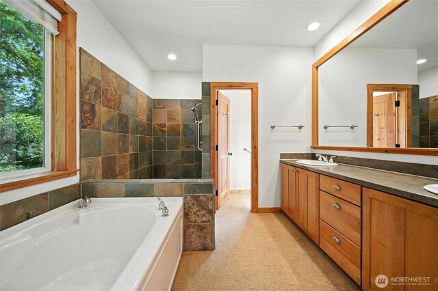 847 SE Covey Ct, College Place, WA 99324 - full bathroom featuring double vanity, a garden tub, tiled shower, and recessed lighting