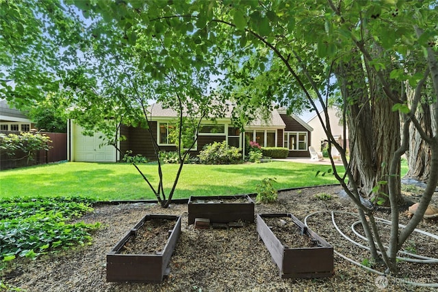 847 SE Covey Ct, College Place, WA 99324 - view of yard with a vegetable garden and an attached garage