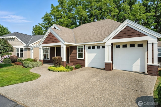 847 SE Covey Ct, College Place, WA 99324 - craftsman inspired home with driveway, an attached garage, a shingled roof, and a front lawn