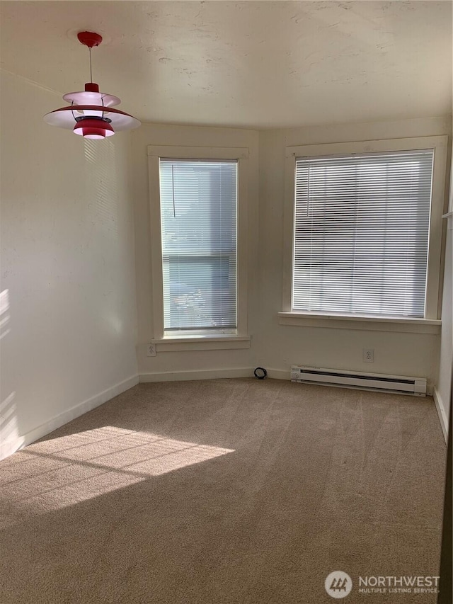 316 N F, Aberdeen, WA 98520 - empty room featuring a baseboard heating unit and carpet flooring
