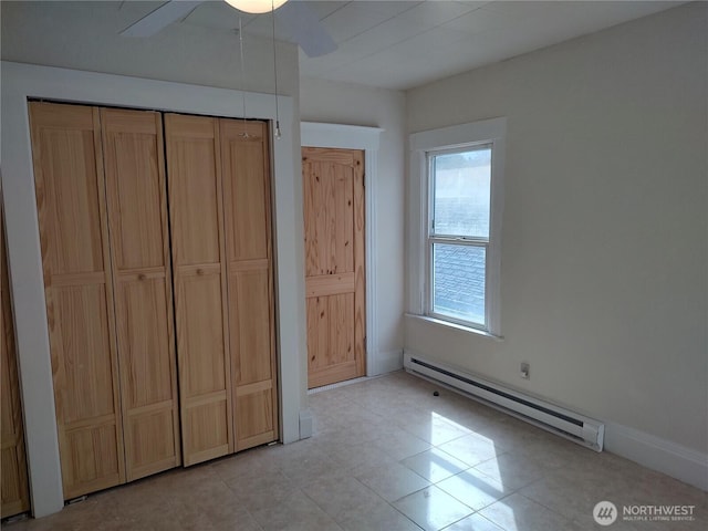 316 N F, Aberdeen, WA 98520 - unfurnished bedroom with a baseboard heating unit, a closet, and a ceiling fan