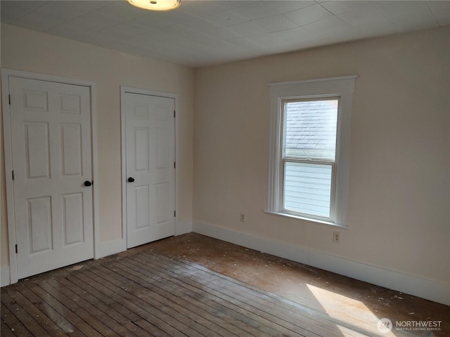 316 N F, Aberdeen, WA 98520 - unfurnished bedroom with wood-type flooring and baseboards