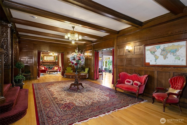 lobby featuring beamed ceiling and wood walls