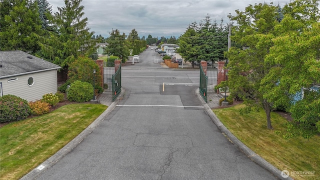 2610 E Section St Unit 20, Mount Vernon, WA 98274 - view of asphalt street featuring a gate, a gated entry, and curbs