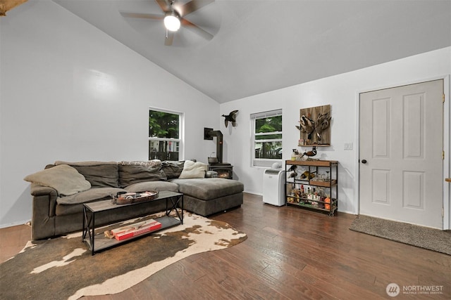 6258 Bellwood Dr, Maple Falls, WA 98266 - living area with a wood stove, ceiling fan, dark wood-type flooring, and high vaulted ceiling