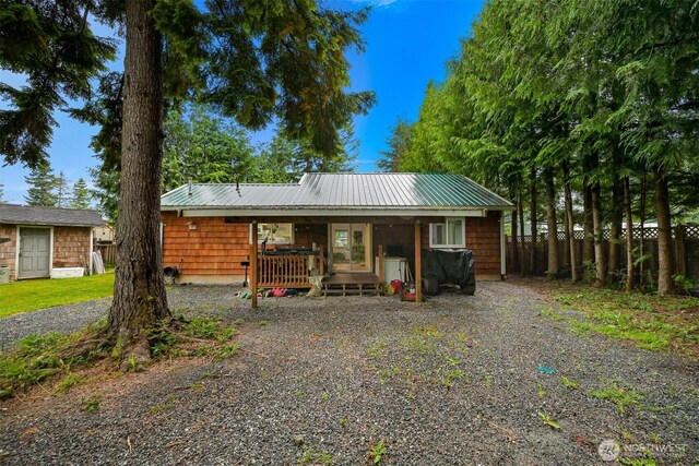6258 Bellwood Dr, Maple Falls, WA 98266 - view of front of home with gravel driveway and a metal roof