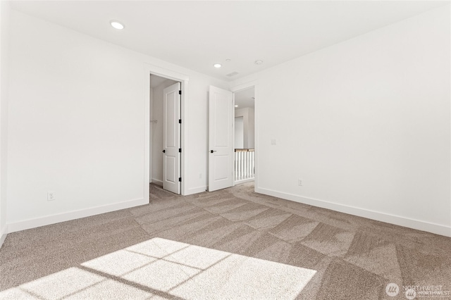 13937 181st St E Unit 8, Puyallup, WA 98374 - carpeted spare room featuring baseboards and recessed lighting