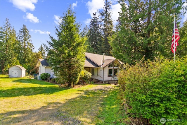 3863 Paradise Bay Rd, Port Ludlow, WA 98365 - view of home's exterior featuring a storage unit and a yard