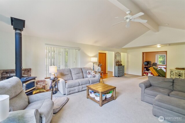 3863 Paradise Bay Rd, Port Ludlow, WA 98365 - carpeted living area with a wood stove and a ceiling fan