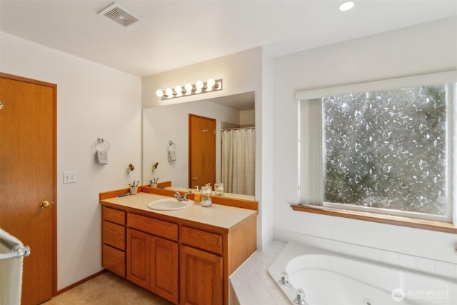3863 Paradise Bay Rd, Port Ludlow, WA 98365 - full bathroom featuring healthy amount of natural light, vanity, and a whirlpool tub