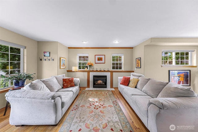 2616 16th St, Bellingham, WA 98229 - living room with plenty of natural light, wood finished floors, a tiled fireplace, and recessed lighting