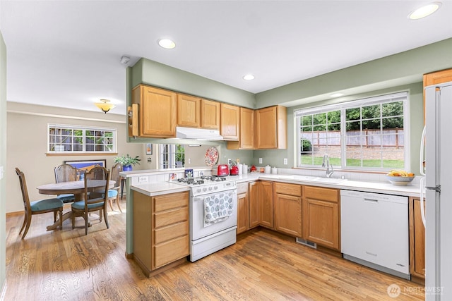 2616 16th St, Bellingham, WA 98229 - kitchen featuring white appliances, under cabinet range hood, light countertops, light wood finished floors, and recessed lighting