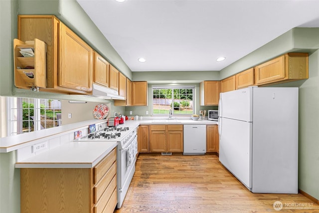 2616 16th St, Bellingham, WA 98229 - kitchen featuring white appliances, light countertops, light wood finished floors, recessed lighting, and a peninsula