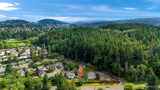2616 16th St, Bellingham, WA 98229 - aerial view of a heavily wooded area and a mountainous background