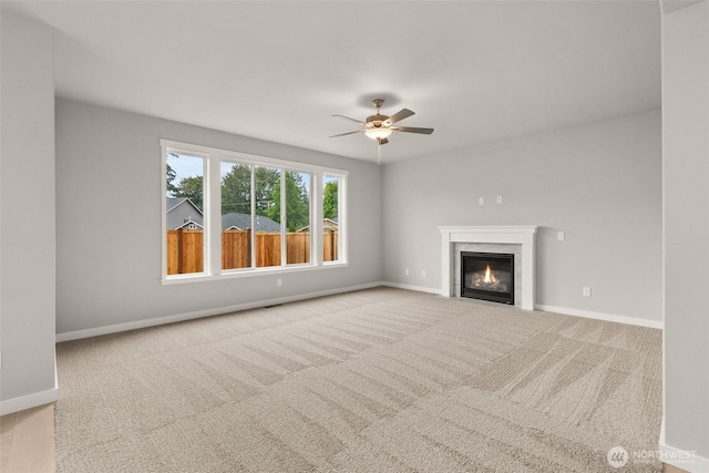1401 89th Ave SE, Tumwater, WA 98501 - unfurnished living room with a ceiling fan, carpet, and a fireplace