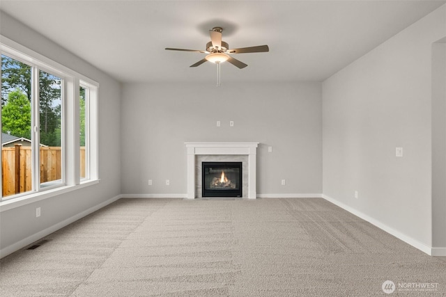 1401 89th Ave SE, Tumwater, WA 98501 - unfurnished living room featuring ceiling fan, a fireplace, and carpet flooring