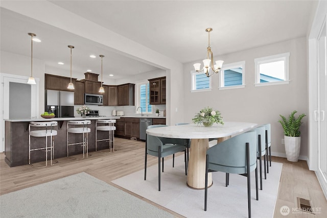 1401 89th Ave SE, Tumwater, WA 98501 - dining area with a chandelier, healthy amount of natural light, light wood finished floors, and recessed lighting