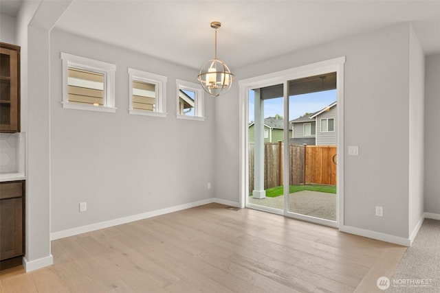 1401 89th Ave SE, Tumwater, WA 98501 - unfurnished dining area featuring a chandelier and light wood-style floors