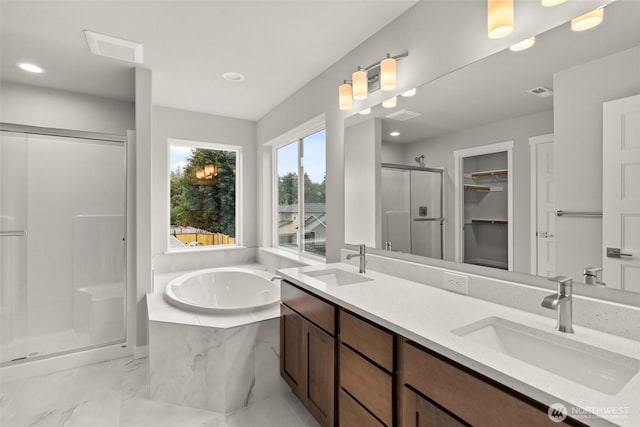 1401 89th Ave SE, Tumwater, WA 98501 - bathroom with a shower stall, a bath, double vanity, recessed lighting, and a walk in closet