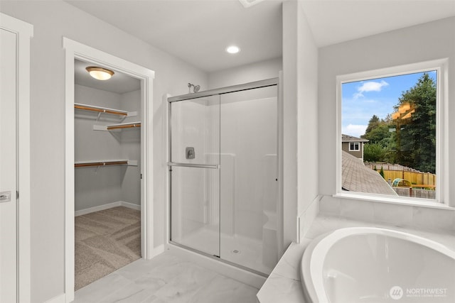 1401 89th Ave SE, Tumwater, WA 98501 - full bathroom with a shower stall, a bath, a walk in closet, marble look tiles, and recessed lighting