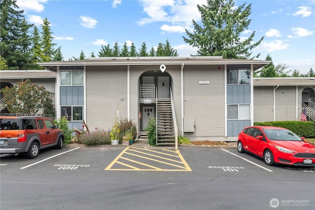 17306 NE 45th St Unit 116, Redmond, WA 98052 - view of property featuring uncovered parking and stairs