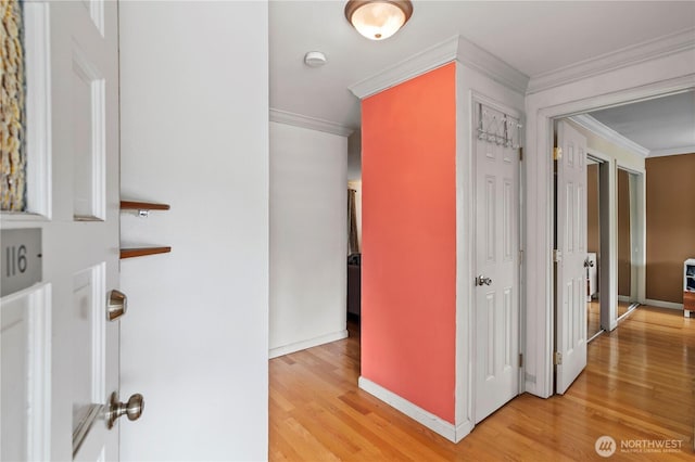 17306 NE 45th St Unit 116, Redmond, WA 98052 - hallway with ornamental molding and light wood-style floors