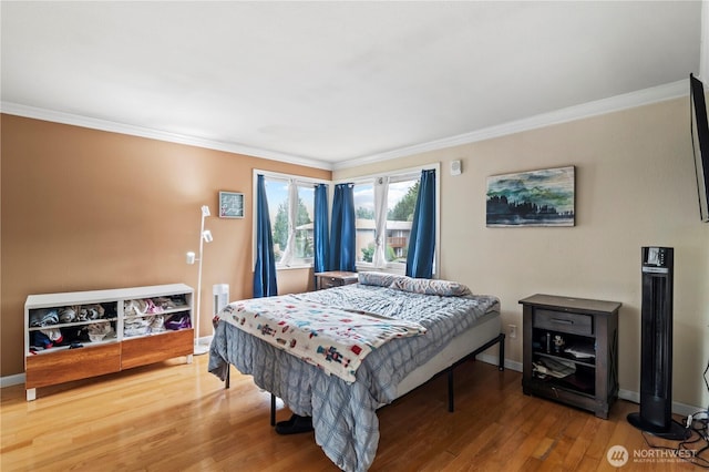 17306 NE 45th St Unit 116, Redmond, WA 98052 - bedroom featuring ornamental molding and wood finished floors