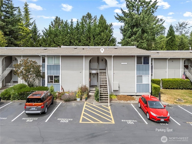 17306 NE 45th St Unit 116, Redmond, WA 98052 - view of property featuring uncovered parking