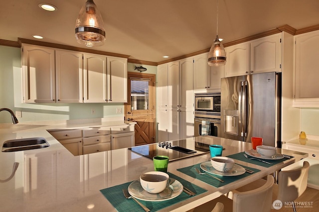 2267 Eastpoint Dr, Langley, WA 98260 - kitchen featuring stainless steel appliances, white cabinetry, a breakfast bar, recessed lighting, and light countertops