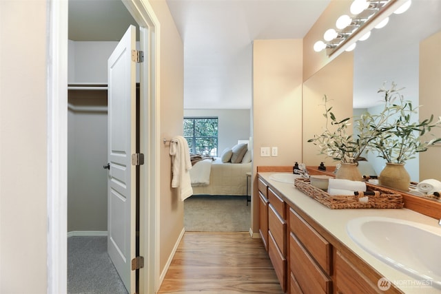 9323 4th Ave W, Everett, WA 98204 - ensuite bathroom featuring double vanity, wood finished floors, and a spacious closet