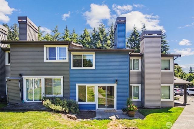 26327 116th Ave SE Unit E102, Kent, WA 98030 - back of property with a chimney and a yard