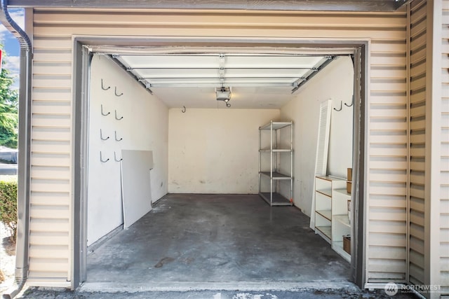 26327 116th Ave SE Unit E102, Kent, WA 98030 - garage featuring a garage door opener