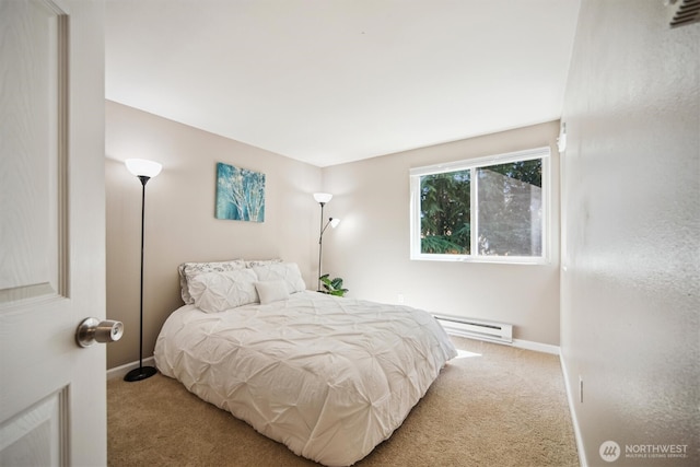 26327 116th Ave SE Unit E102, Kent, WA 98030 - bedroom with a baseboard heating unit and carpet floors