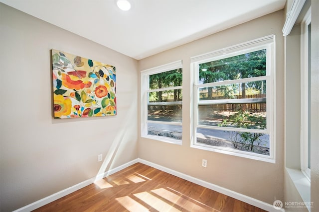 26327 116th Ave SE Unit E102, Kent, WA 98030 - empty room featuring baseboards and wood finished floors