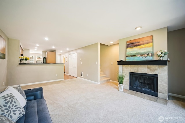 26327 116th Ave SE Unit E102, Kent, WA 98030 - unfurnished living room featuring carpet, a fireplace, recessed lighting, and stairway