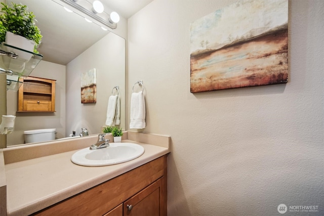 26327 116th Ave SE Unit E102, Kent, WA 98030 - bathroom featuring vanity and toilet