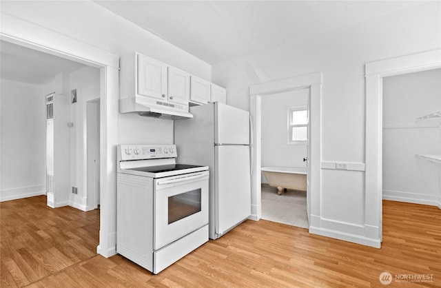 3510 S K St, Tacoma, WA 98418 - kitchen with white appliances, under cabinet range hood, light wood finished floors, and white cabinets