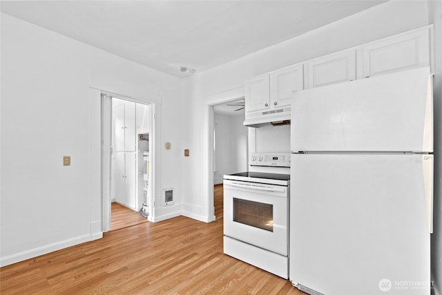 3510 S K St, Tacoma, WA 98418 - kitchen featuring white appliances, white cabinetry, light wood-type flooring, and under cabinet range hood