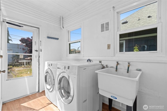 3510 S K St, Tacoma, WA 98418 - washroom featuring light wood finished floors and washing machine and dryer