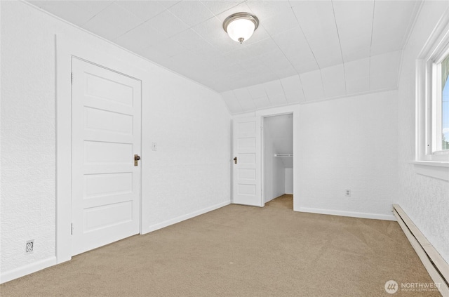3510 S K St, Tacoma, WA 98418 - unfurnished bedroom featuring a baseboard radiator, carpet flooring, lofted ceiling, a textured wall, and a closet