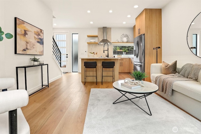 1120 NW 61st St Unit B, Seattle, WA 98107 - living room featuring recessed lighting, light wood finished floors, and stairs